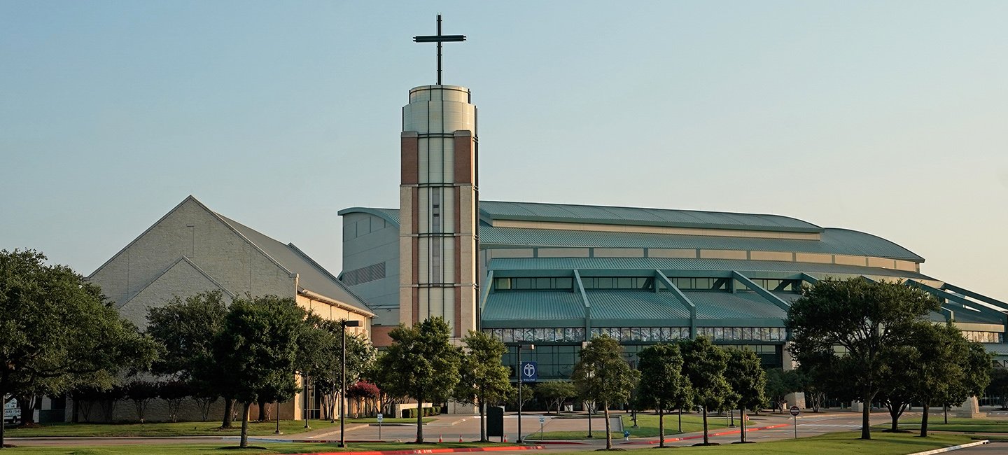 The Prestonwood Baptist Church Plano campus building beneath a blue sky